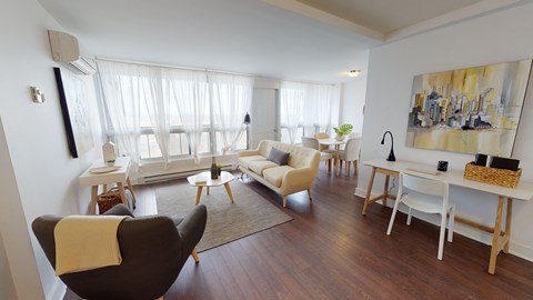 a living room and dining room with a table and chairs